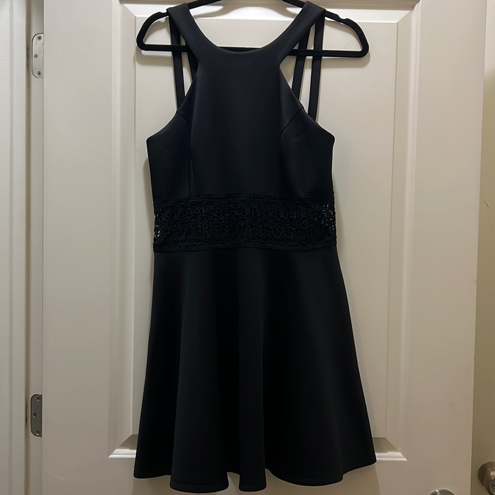 Black dress with knitted design around the mid area. In perfect condition
